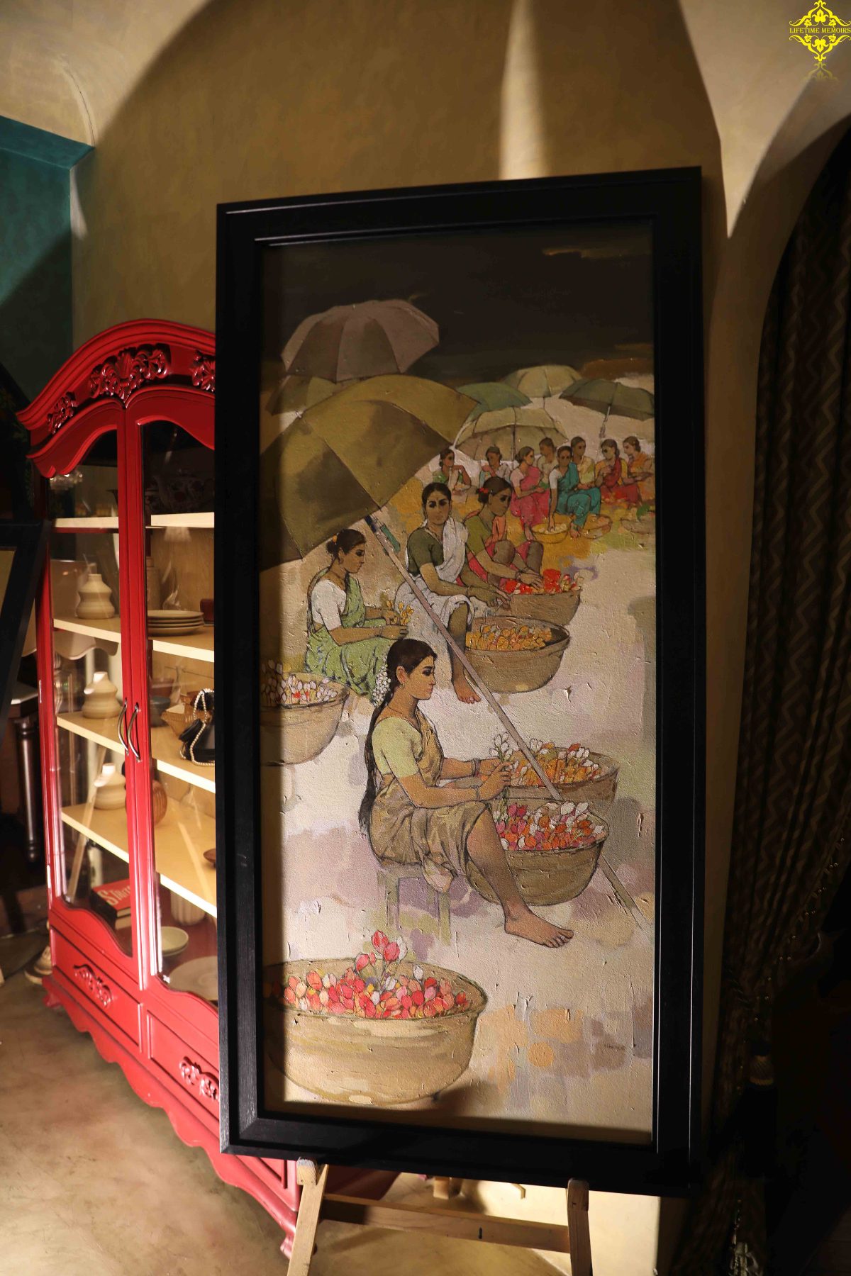 Flower sellers beneath umbrellas